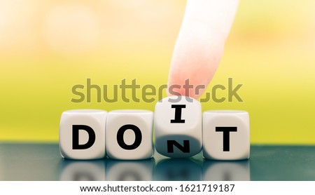 Hand turns a dice and changes the expression 