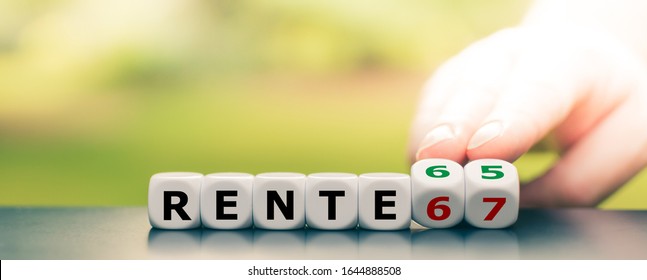 Hand turns dice and changes the German Expression "Rente 67" ("pension 67") to "Rente 65" ("pension 65"). - Shutterstock ID 1644888508