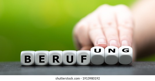 Hand turns dice and changes the German word "Beruf" (job) to "Berufung" (profession).