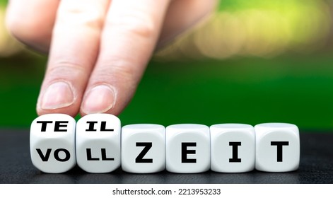 Hand Turns Dice And Changes The German Expression 'vollzeit' (full Time) To 'teilzeit' (part Time).