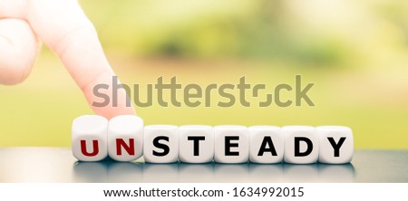 Hand turns dice and changes the word 
