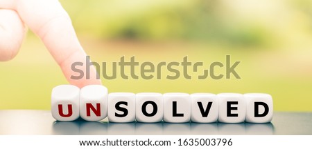 Hand turns dice and changes the word 
