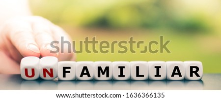 Hand turns dice and changes the word 