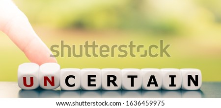 Hand turns dice and changes the word 