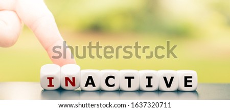 Hand turns dice and changes the word 