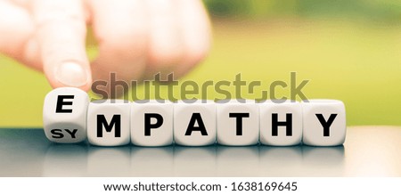 Hand turns dice and changes the word 