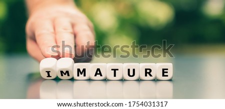Hand turns dice and changes the word 