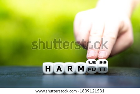 Hand turns dice and changes the word 