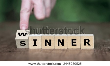 Hand turns dice and changes the word sinner to winner. Symbol for stop being a sinner and become a winner.