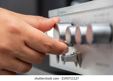 The Hand Turns The Volume Knob On The Sound Equipment, Selective Focus.