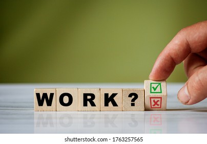 The hand turns the wooden cube and changes the word ask WORK with green positive tick check box and red reject X check box. - Shutterstock ID 1763257565