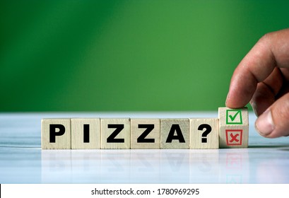 The hand turns the wooden cube and changes the word PIZZA with green positive tick check box and red reject X check box. - Shutterstock ID 1780969295