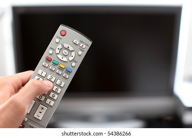 Hand with TV remote control