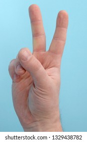 Hand With Two Fingers Up. Sigh Of Peace Or Victory. Also The Sign For The Letter V In Sign Language