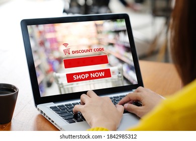 Hand Typing Discount Coupon Code On Laptop Computer Screen To Get The Shopping Online Sale Promotion, Online Shopping , Digital Marketing Business And Technology, Lifestyle Concept