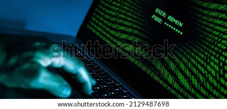 Hand typing on a laptop keyboard green numbers on display. Successful login with credentials user and password in the system. Technology communication, security protection, hacker, cyber crime concept
