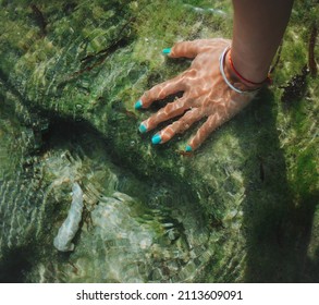 Hand Under Fresh Water. Nature Touch