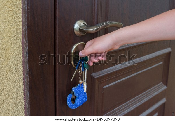 Hand Unlocks Front Door Key Man Stock Photo Edit Now 1495097393
