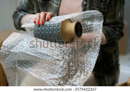 Image, Stock Photo Unrecognizable young woman crafting with paper and scissors