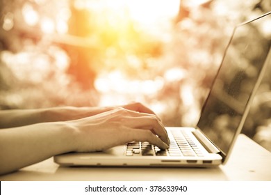 Hand use computer laptop from home. Vintage filter. - Shutterstock ID 378633940