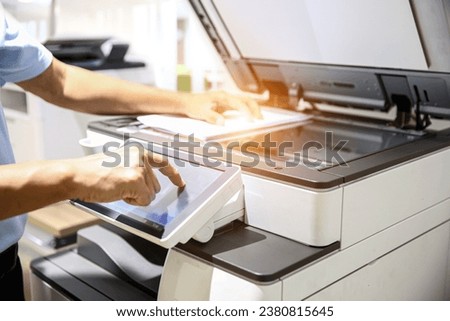 Hand use copier or photocopier or photocopy machine office equipment workplace for scanner or scanning document or printer for printing paperwork hard copy duplicate service maintenance repair.