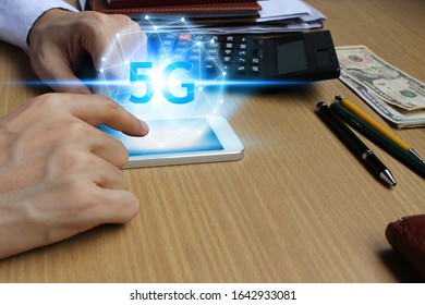 hand use smartphone network using 5G technology with virtual screen, Technology Internet 5G global network concept.
