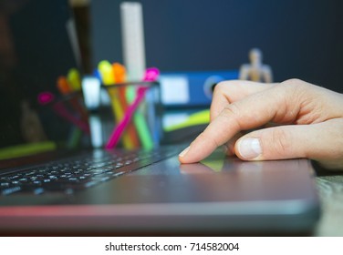 A hand use touchpad made for notebook with a light at his finger