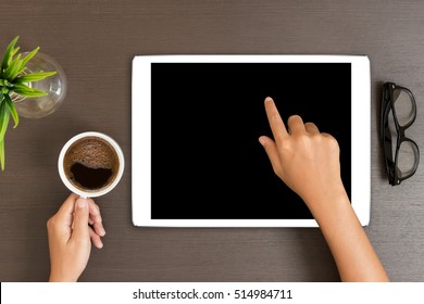 Hand Use White Tablet On Desk Table Top View