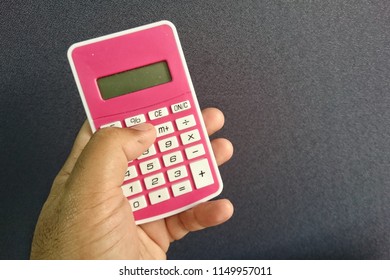 hand using a calculator 