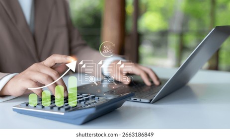 Hand using a calculator with the net zero carbon concept and green growth chart. Sustainability finance planning, CO2 footprint analysis, ESG reporting, and climate action business strategy.