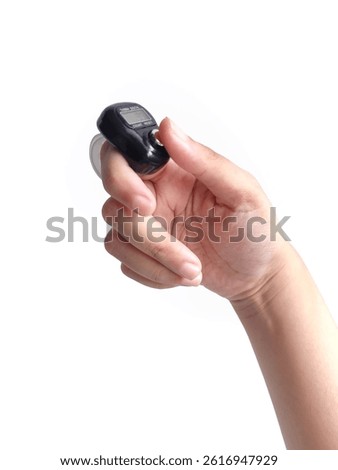 Hand Using a Compact Black Digital Finger Counter with Adjustable Strap - Portable Tally Counter Isolated on White 