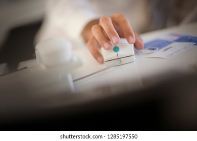 Hand using a computer mouse.