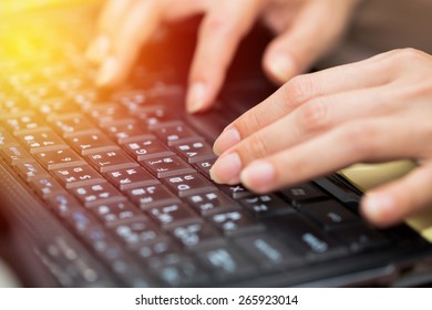 Hand using computer PC working business from home.