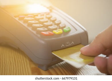 Hand Using Credit Card Swiping Machine Entering Credit Card Code To Pay Shopping Online.creditcard Swipe Through Terminal For Payment In Shop,buy And Sell Products & Service,internet Of Things,vintage