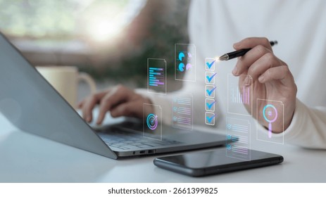 Hand using a digital checklist interface with charts and AI icons on a laptop. Concept of online workflow automation, task management, and digital transformation in business.