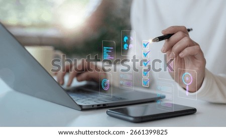 Hand using a digital checklist interface with charts and AI icons on a laptop. Concept of online workflow automation, task management, and digital transformation in business.