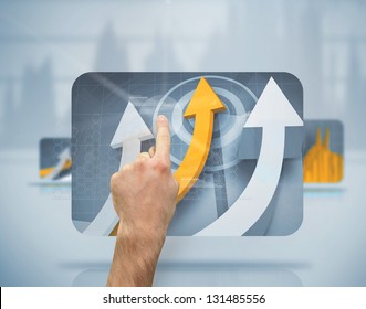 Hand using digital screen with graph arrows