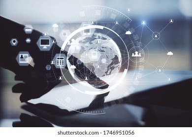 Hand using digital tablet with abstract global network interface. Business and technology concept. Close up