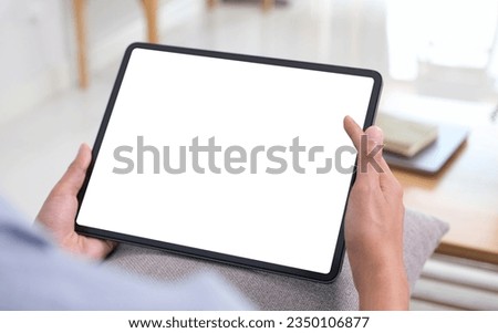 Hand using digital tablet with blank screen for mock up, template, people technology and lifestyle 