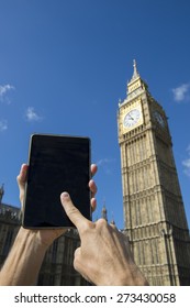 Hand Using Digital Tablet Computer Outside Big Ben Westminster Palace London Under Bright Blue Skies