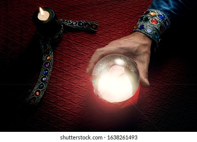 hand using esoteric ball to predict the future