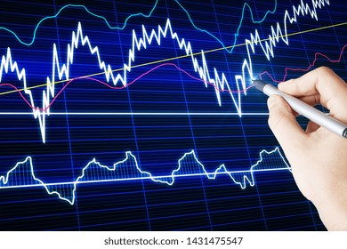 Hand using forex chart interface on blurry background. Trade and finance concept