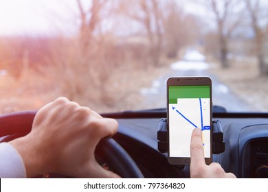 A hand using Google Navigation App