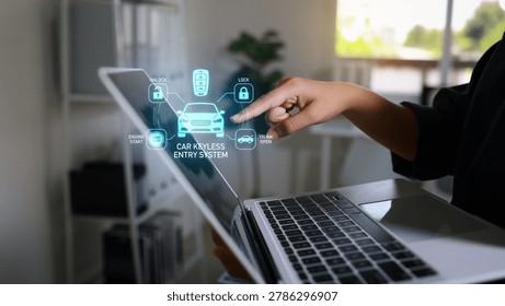 Hand using laptop with augmented reality interface showing car keyless entry system icons for lock, unlock, trunk and engine start in a modern home office. - Powered by Shutterstock - Get 15% off with code: PIKWIZARD15