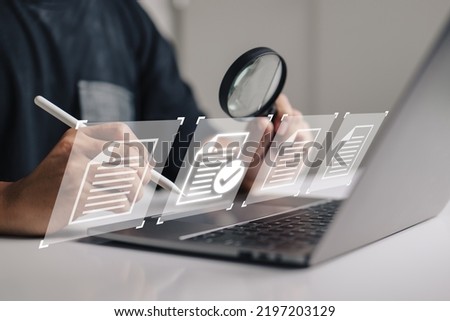 hand using a laptop computer with a virtual screen and document for paperless quality assurance and ERP management concept for online approval.