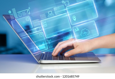 Hand using laptop with database reports and online work concept - Shutterstock ID 1201685749