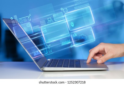 Hand using laptop with database reports and online work concept