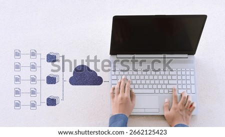 Hand using laptop uploading data to cloud storage, online database management, file sharing, and cloud computing technology for digital business and remote work.