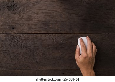 Hand Using Mouse On Office Table. View From Top.