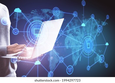 Hand using notebook with abstract computer map and digital icons hologram on blue background. Cloud computing and data storage concept